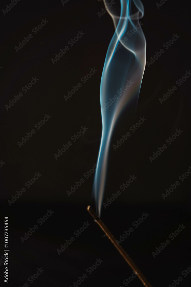 Incense burning smoke fumes and wisps. Aromatherapy smokes for yoga. Aroma sticks smoke on black background with white backlit. Burning aromatic incense smoky stick for meditation and relaxing. Incense burning smoke fumes and wisps. Aromatherapy smokes for yoga. Aroma sticks smoke on black background with white backlit. Burning aromatic incense smoky stick for meditation and relaxing.