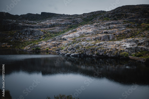 Wallpaper Mural A panoramic view of the mountains and lake in Serra da Estrela, Portugal, captured in rainy weather, creating a serene and mystical landscape. Torontodigital.ca