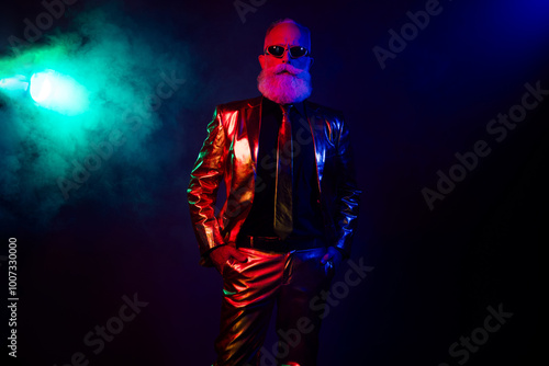 Confident serious boss wear stylish outfit celebrate corporate new year party isolated on dark neon color background