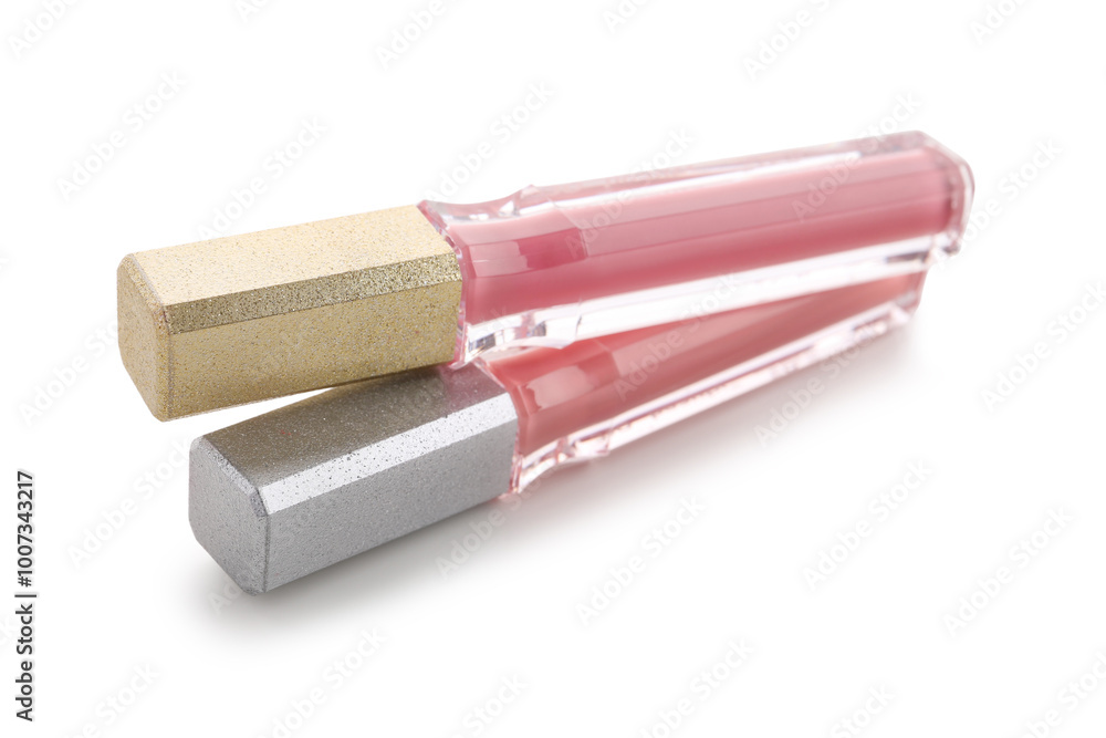 Beautiful liquid pink lipsticks in different shades on white background Beautiful liquid pink lipsticks in different shades on white background