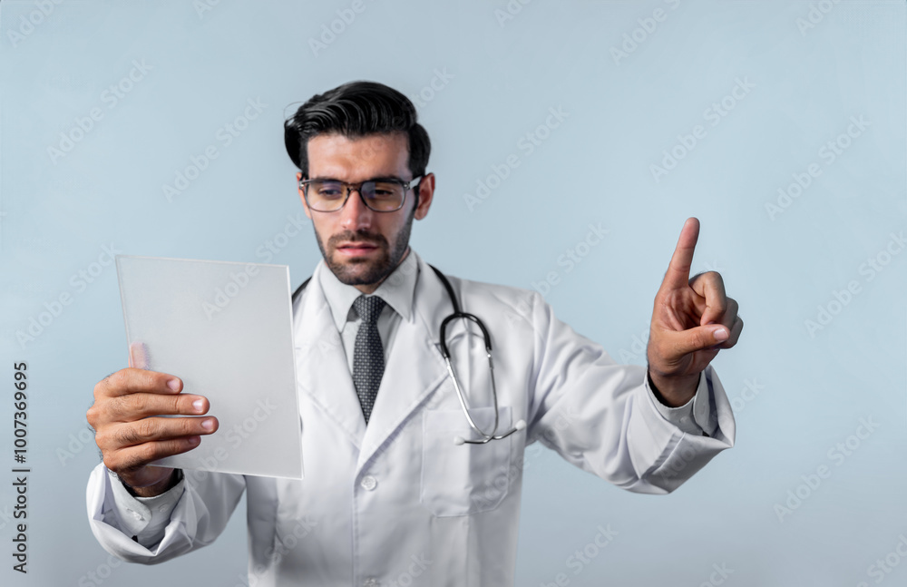 Caucasian smart doctor pointing finger while standing at white background and wearing lab coat. Skilled specialist doctor using medical technology while pointing and holding health data. Deviation. Caucasian smart doctor pointing finger while standing at white background and wearing lab coat. Skilled specialist doctor using medical technology while pointing and holding health data. Deviation.