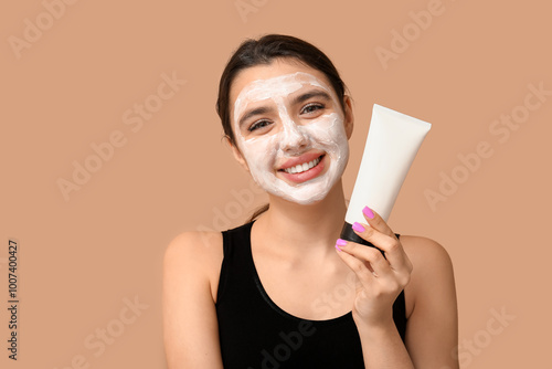 Happy young woman with faci...