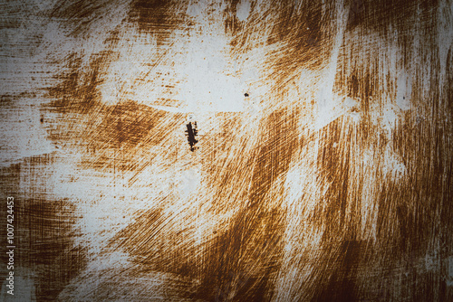 A brown and white background with a few brown spots. The background is a bit rough and has a rustic feel to it