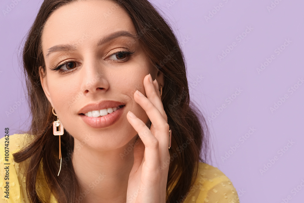 Smiling woman with beautiful jewelry on purple background Smiling woman with beautiful jewelry on purple background