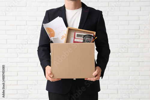 Fired young businessman hol...