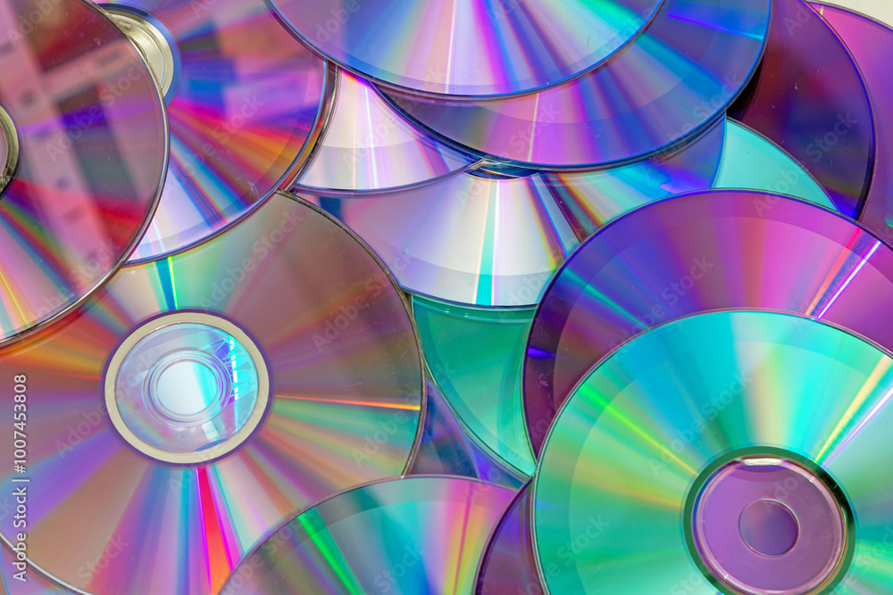 Pile of shiny compact discs pattern background Pile of shiny compact discs pattern background