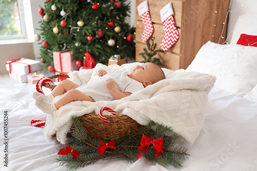 Cute little baby lying in b...