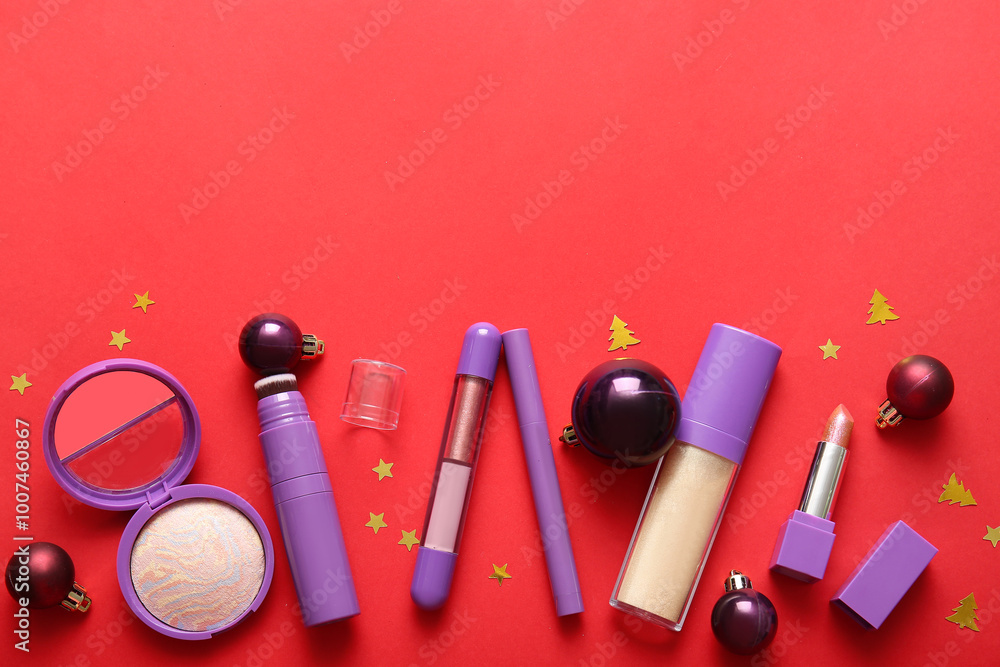 Naklejka premium Composition with decorative cosmetics and Christmas balls on red background