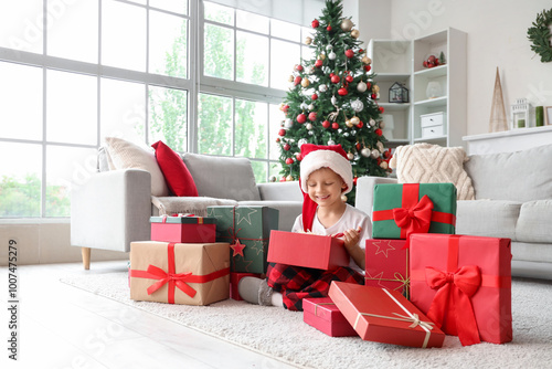 Cute little boy in Santa ha...