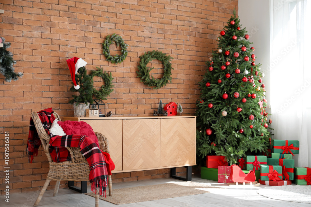 Obraz premium Interior of living room with Christmas trees, wreaths and armchair