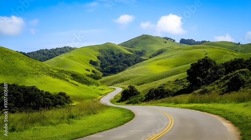 A serene landscape featuring a winding road through lush green hills, with a clear blue sky overhead and ample space for text overlay