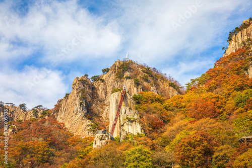 Autumnal view of a bridge to the top at Daedun Mt near Wanju-gun, South Korea photo