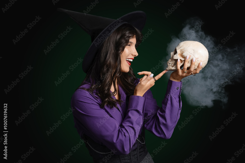 Young witch with skull and smoke on dark background Young witch with skull and smoke on dark background