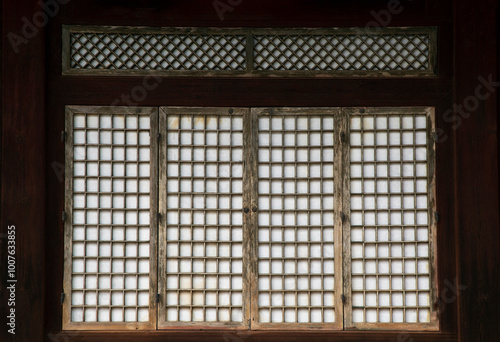 Wooden door with hanji at Changdeokgung Palace near Jongno-gu, Seoul, South Korea photo