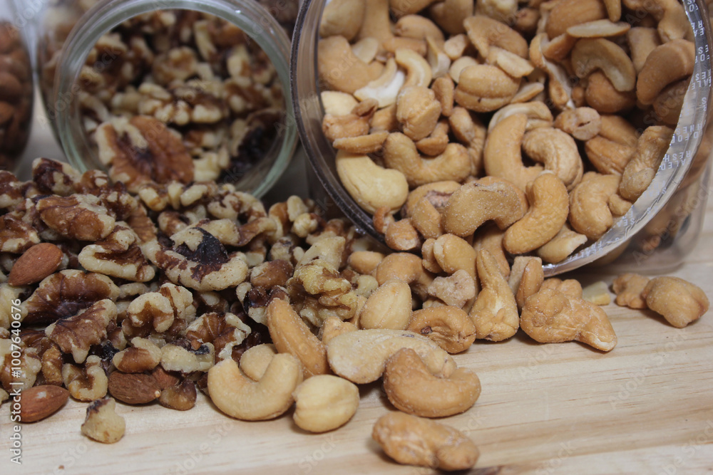 Jars of Various Nuts on Wooden Table Jars of Various Nuts on Wooden Table