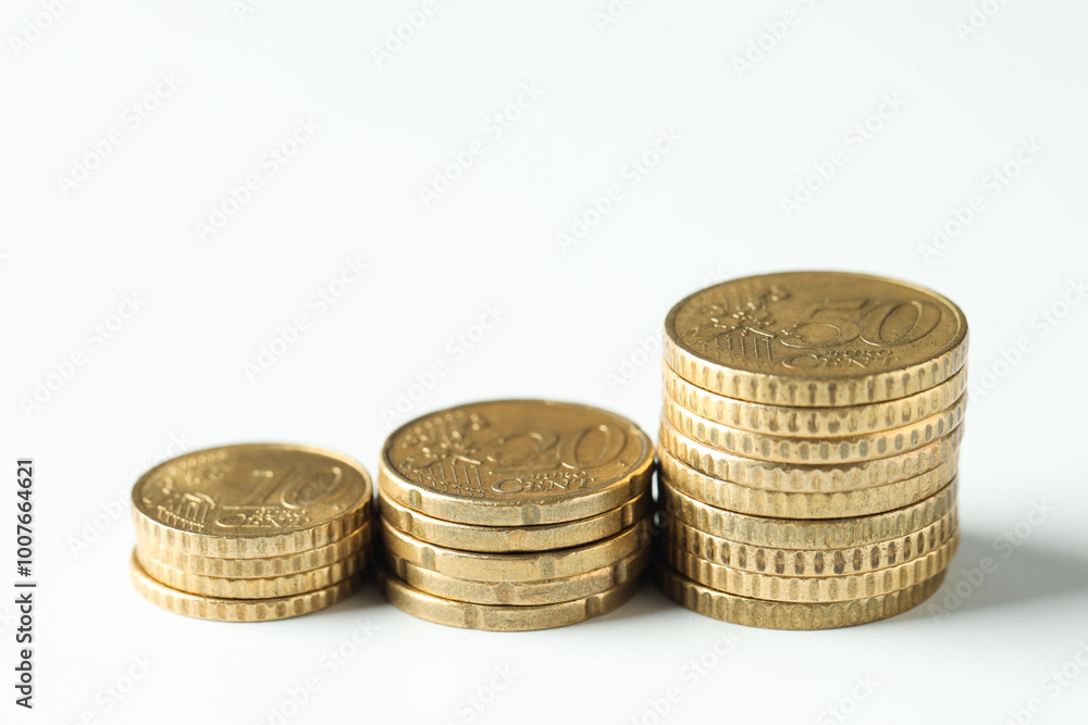 Stacked euro coins on white background, closeup Stacked euro coins on white background, closeup