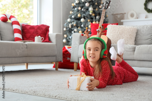 Cute little girl in reindee...