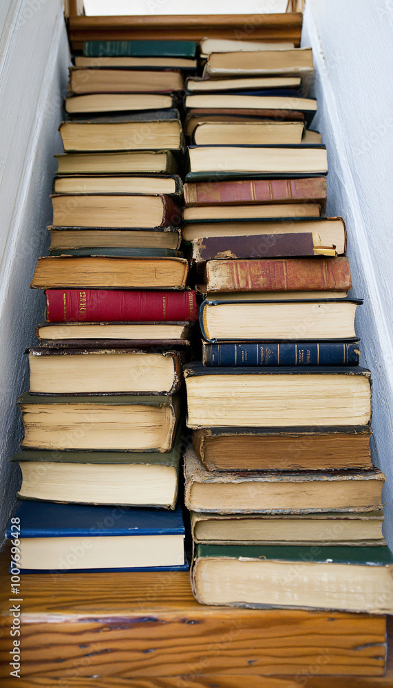 Naklejka premium stack of books on a blue background