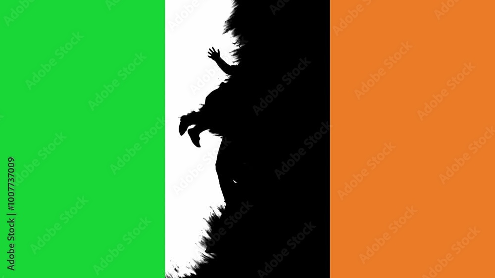 Reveal of a Silhouette of a Father Holding His Daughter on an Irish Flag Reveal of a Silhouette of a Father Holding His Daughter on an Irish Flag