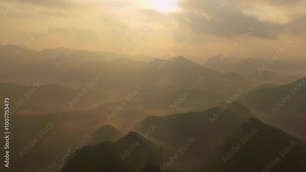 Drone aerial view Hyperlapse of landscape mountains view with fog flowing over mountains,High angle view clouds over countryside at northern Vietnam