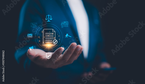 Compliance in business to laws and regulations, ethical operations. businessman hand holding compliance icons on a virtual screen symbolizes the commitment to enforce standards and internal policies.