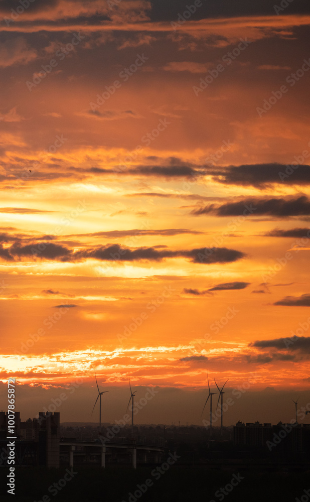 Fototapeta premium The setting sun reddened the sky, the countryside skyline, and the scenery background.