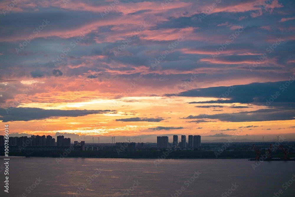 The setting sun reddened the sky, the countryside skyline, and the scenery background. The setting sun reddened the sky, the countryside skyline, and the scenery background.
