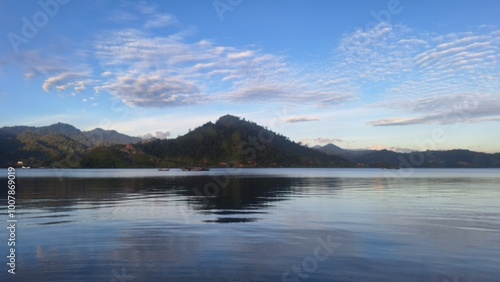 Beautiful contrast views the dark hills and blue sky. The picture was taken from the middle of the sea. Pesisir Selatan, West Sumatra, Indonesia