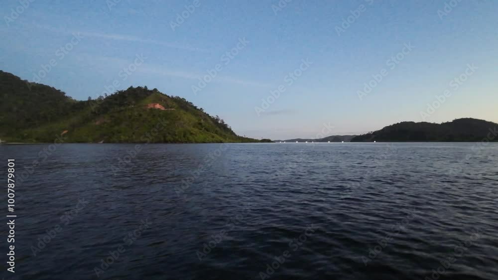 Beautiful view in the afternoon towards evening. The island and the hill seen from the ocean. Footage moves sideways scene. Puncak Paku, Mandeh, West Sumatra, Indonesia. Beautiful view in the afternoon towards evening. The island and the hill seen from the ocean. Footage moves sideways scene. Puncak Paku, Mandeh, West Sumatra, Indonesia.