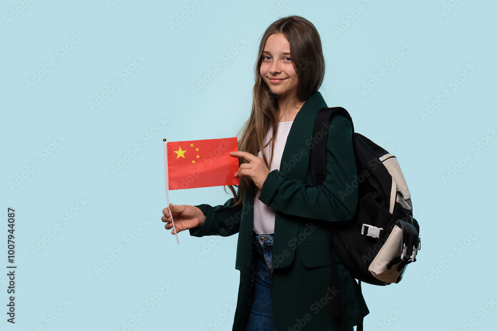 Teen girl holding Chinese flag, with backpack, casual look. Teen girl holding Chinese flag, with backpack, casual look.
