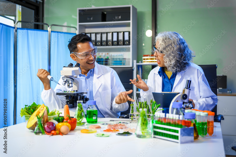 A reliable middle-aged Asian male researcher collaborates with experienced gray-haired elderly Asian female nutritionist in laboratory, food ingredients, extracts, their impact on nutrition health. A reliable middle-aged Asian male researcher collaborates with experienced gray-haired elderly Asian female nutritionist in laboratory, food ingredients, extracts, their impact on nutrition health.