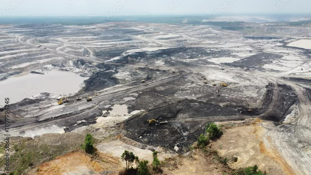Aerial view panorama of open pit coal mining, dumper, extractive industry excavation, very large mine. Big Yellow Mining Truck Aerial view panorama of open pit coal mining, dumper, extractive industry excavation, very large mine. Big Yellow Mining Truck