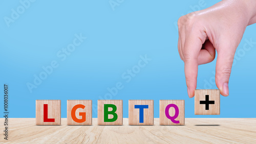 LGBTQ, Concept of Lgbt rights and law, wooden blocks with Text LGBTQ, symbol of law and justice in accepting same sex couples Same Sex Marriage, Adoption, Social Equality.