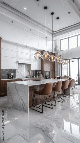 Modern kitchen featuring marble island, stylish bar stools, and elegant lighting in a bright, spacious setting.