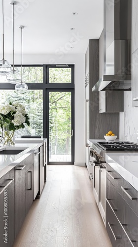 Modern kitchen with sleek cabinets, natural light, and floral arrangement, perfect for contemporary home design inspiration.