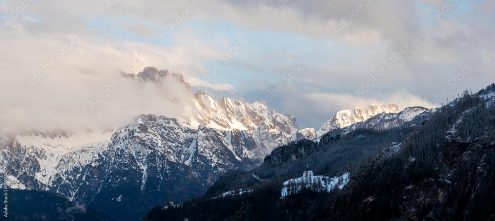 Monte Civetta in Dolomites in sunrise light in fog
