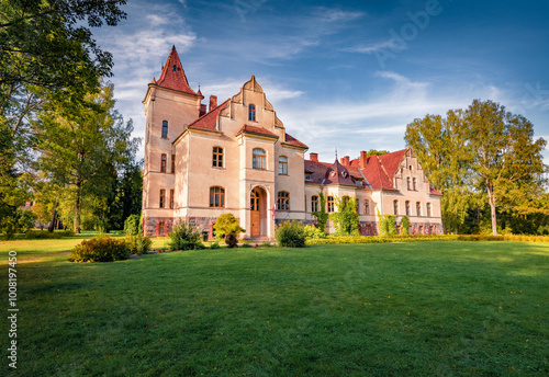 Stunning morning view of old building of Smiltenes Regional History Museum, Latvia, Europe. Colorful summer scene of Meri village, Smiltene Municipality, Latvia, Europe. Traveling concept background. photo