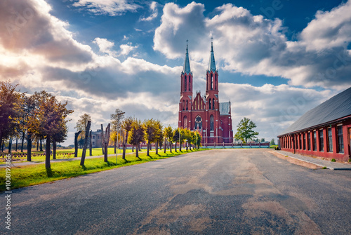 Astonishing morning view of Catholic Church of the Sacred Heart of Jesus. Majestic summer sunrise on Liksna village, Augsdaugava Municipality, Latvia, Europe. Traveling concept background. photo