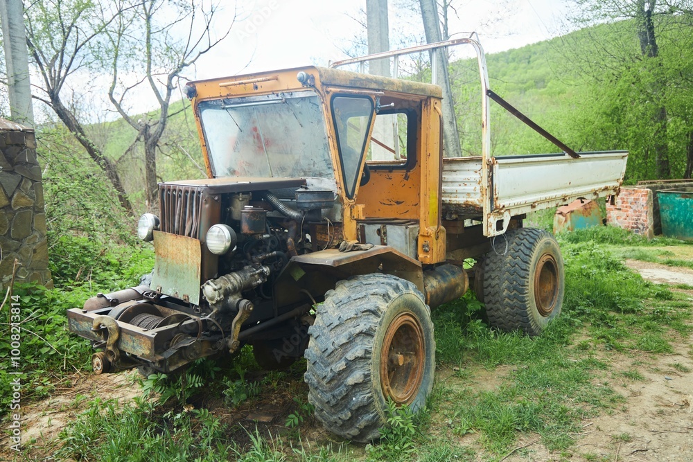 An old rusty homemade tractor. Industrial or agrotechnical equipment An old rusty homemade tractor. Industrial or agrotechnical equipment