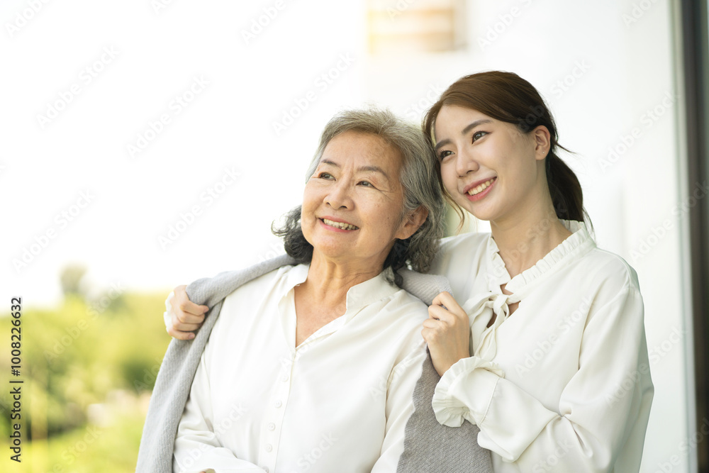 Daughter taking care of her mother by cover with blanket Daughter taking care of her mother by cover with blanket