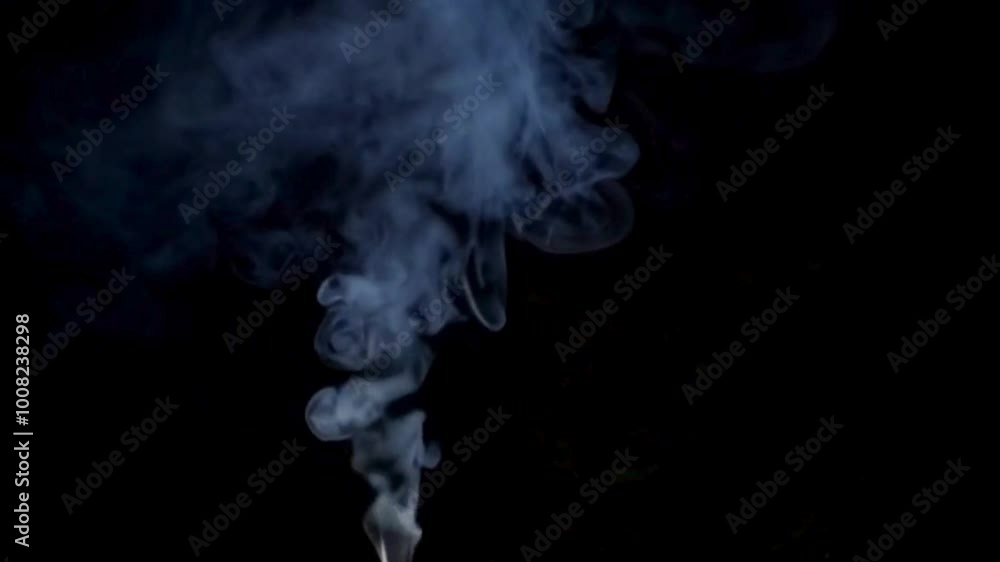 Defocused Smoke Against a Dark Background Defocused Smoke Against a Dark Background