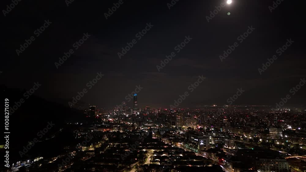 Santiago, Chile, zoom out timelapse view of cityscape showing modern buildings at night. Santiago, Chile, zoom out timelapse view of cityscape showing modern buildings at night.