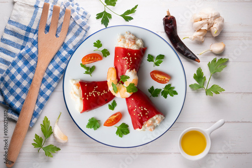 Red piquillo peppers stuffed with cod. Top view table with  decoration. photo