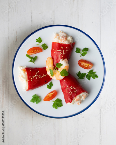 Red piquillo peppers stuffed with cod. Top view table with  decoration. photo