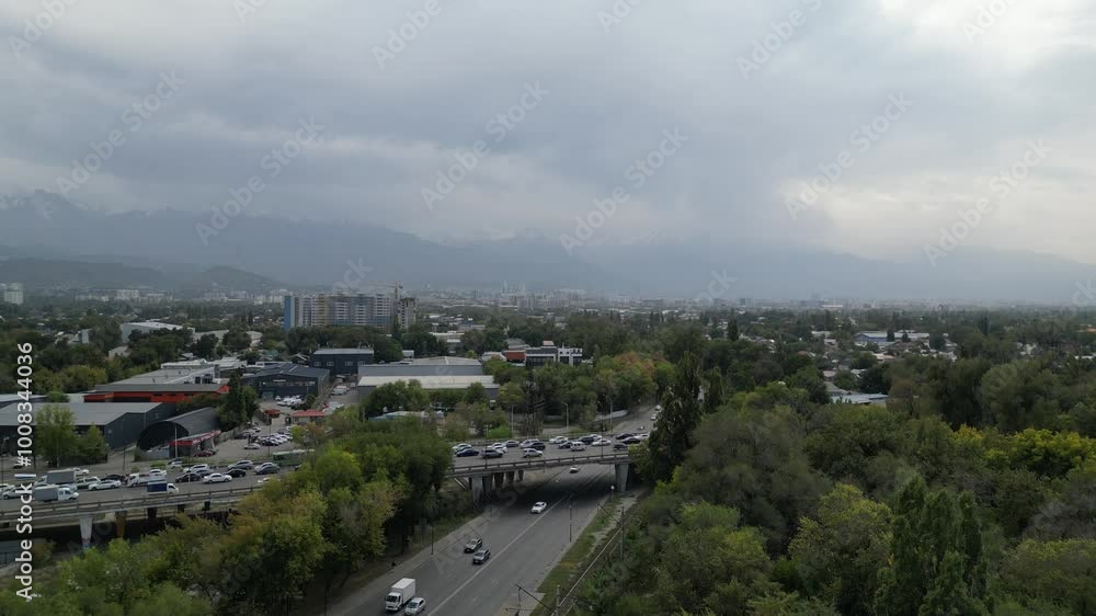 Almaty, Kazakhstan - 10.02.2024 : Traffic on one of the lines of road interchanges. The view from the drone. Almaty, Kazakhstan - 10.02.2024 : Traffic on one of the lines of road interchanges. The view from the drone.