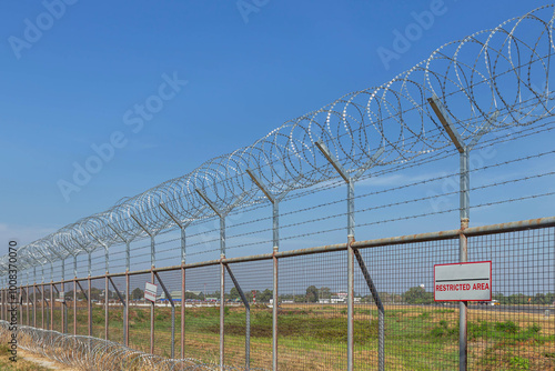 Принти на полотні Razor barbed wire or concertina razor coil barrier security fence restricted are