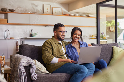 Wallpaper Mural Multiethnic couple using laptop at home Torontodigital.ca