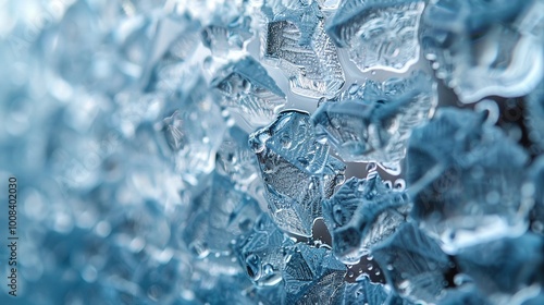 A close-up of a glass logo with a frosted effect.