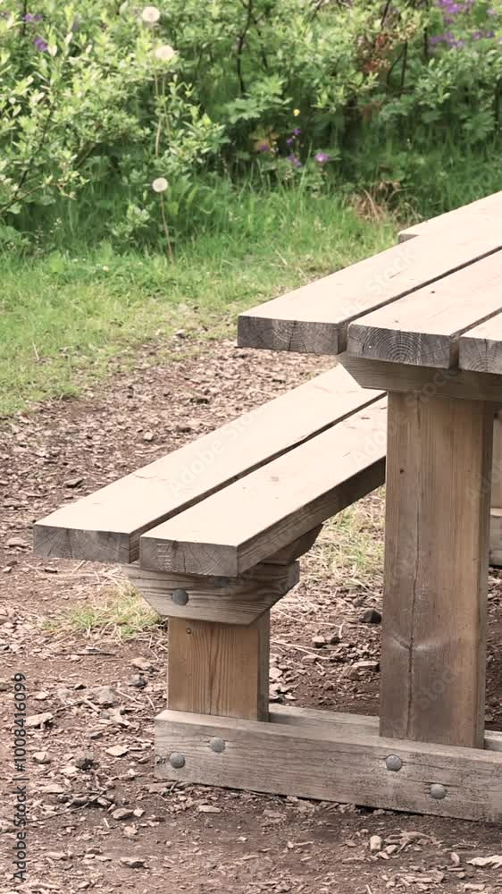 Establishing shot of Picnic Table in Park with mountain lake in slow motion at summer day Establishing shot of Picnic Table in Park with mountain lake in slow motion at summer day