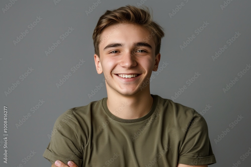 portrait of smiling caucasian young man wearing green t-shirt on grey background, student portrait of smiling caucasian young man wearing green t-shirt on grey background, student
